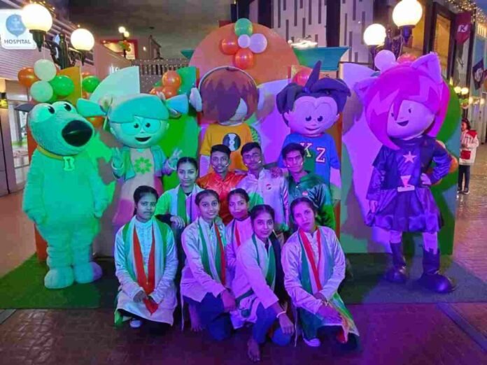 Children celebrating Independence Day with a tricolour map and engaging in patriotic activities at KidZania India.